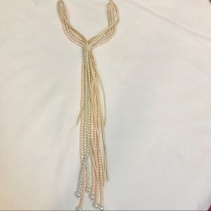 Pearl and  pink beads with suede ties.